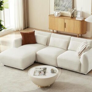 Contemporary white modular sectional sofa in a bright, minimalist living room layout.
