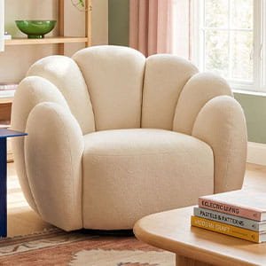 Modern off-white boucle swivel armchair with a unique petal-shaped backres