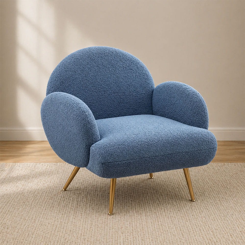 Light blue accent chair with rounded shape in a cozy modern interior