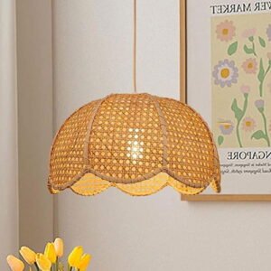 Light-colored woven rattan pendant light fixture with a scallop edge in a living space.