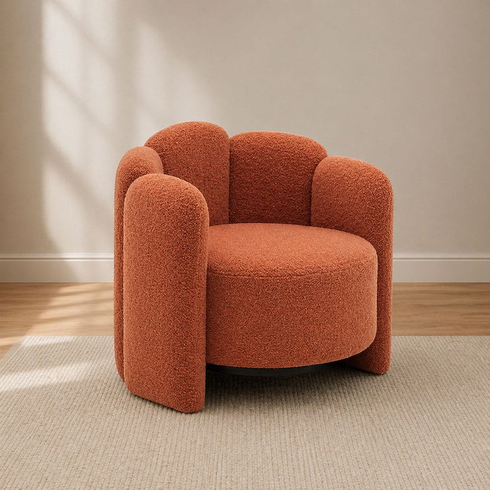 Terracotta boucle accent chair in a cozy minimalist living room