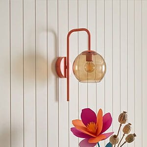 modern wall sconce with glass shade colorful dopamine decor lighting statement piece
