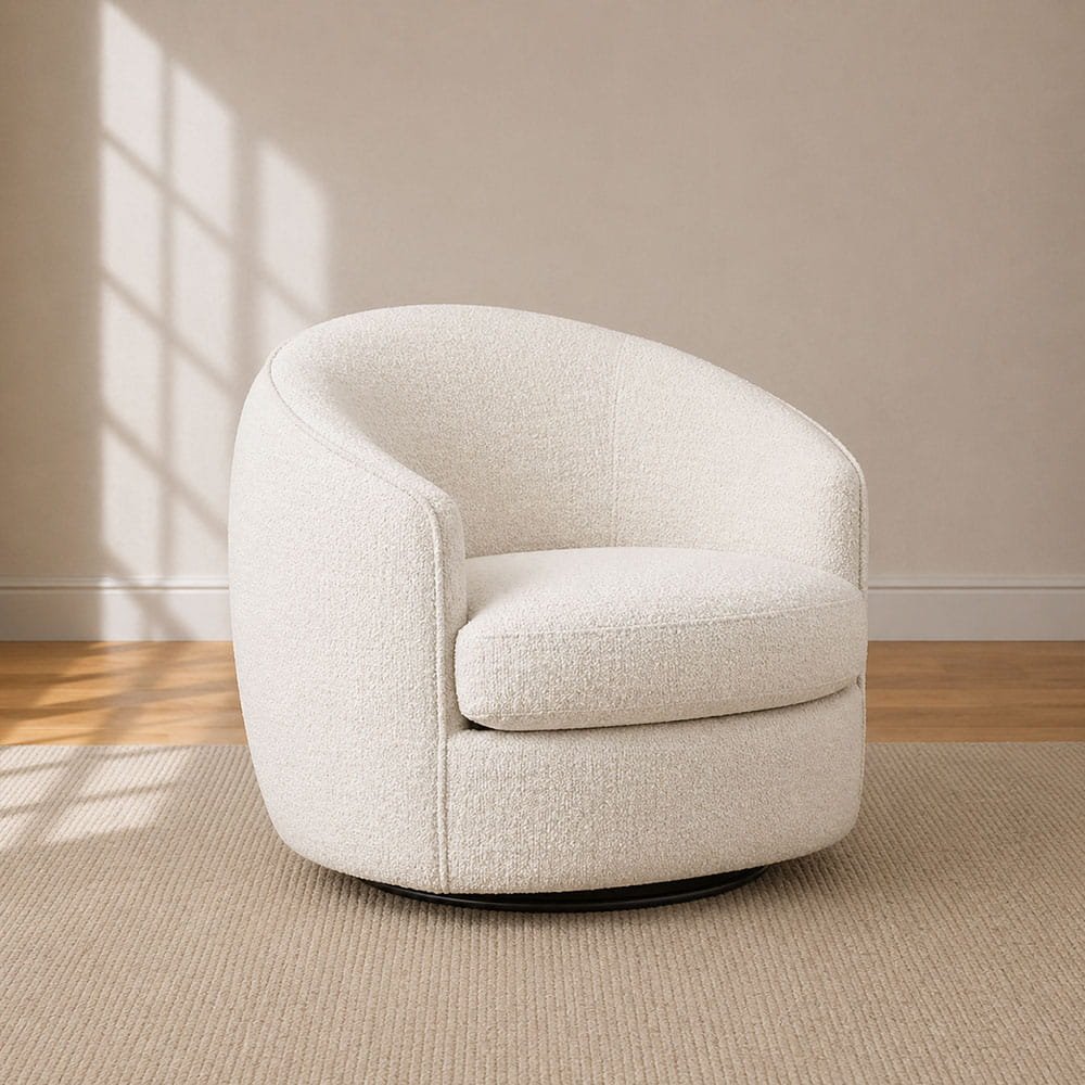 Cream boucle swivel accent chair in a warm minimalist living room