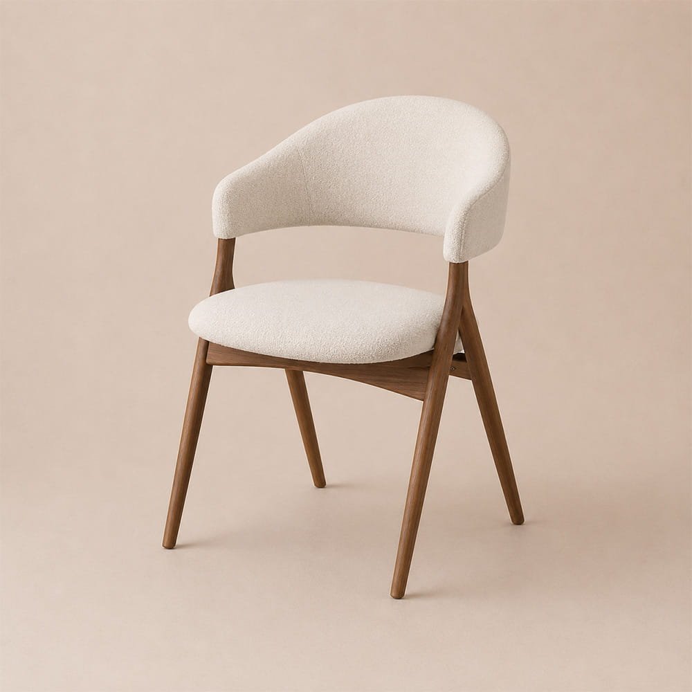 Modern cream upholstered dining chair with curved backrest and walnut wood legs on a neutral beige background.